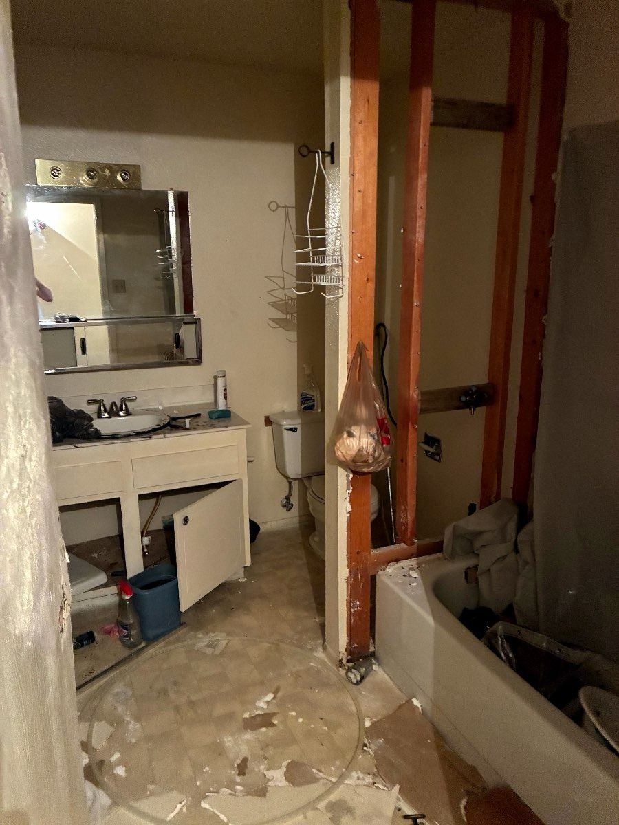 Gutted bathroom with exposed studs in a Las Vegas 89145 house bought as-is