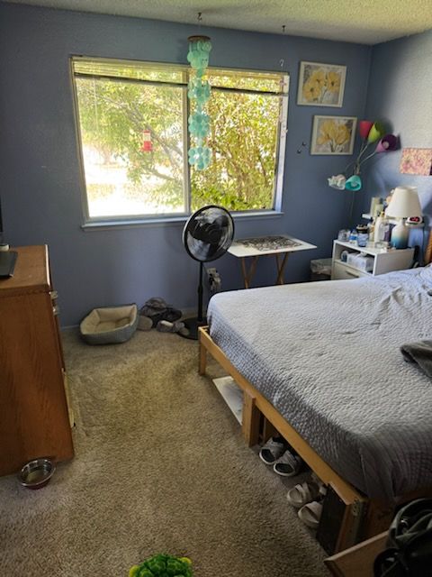 Occupied bedroom with belongings in a Carson City 89705 house bought as-is